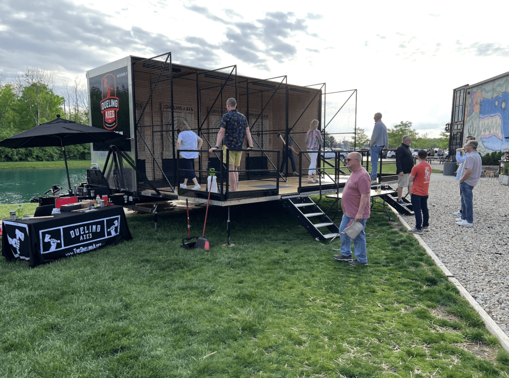 mobile axe throwing trailer at a work party